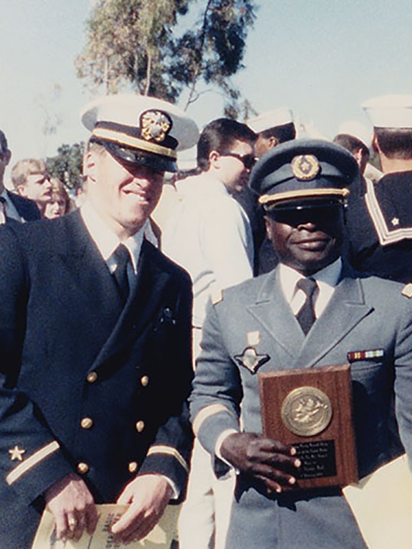 Connors with friend holding award